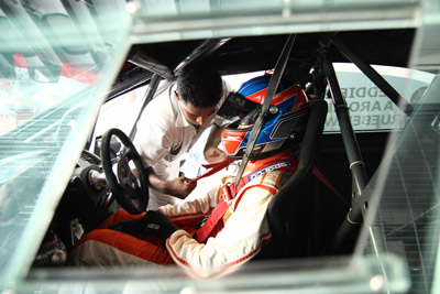 One of the HMRT drivers, Eddie Lew doing his final check before bringing the car to the track